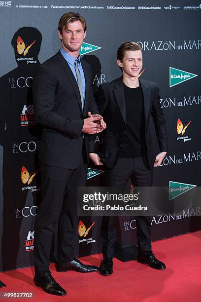 Chris Hemwsworth and Tom Holland attend the 'En el Corazon del Mar' premiere at Callao City Lights Cinema on December 3, 2015 in Madrid, Spain.