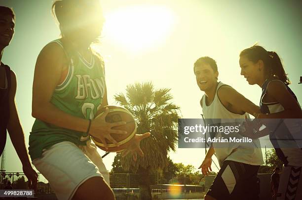 young beautiful and strong basketball players on a match - basketball league stock pictures, royalty-free photos & images