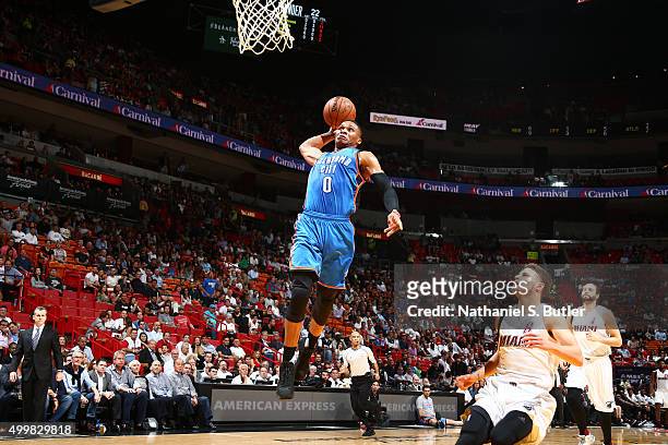 Russell Westbrook of the Oklahoma City Thunder dunks against the Miami Heat on December 3, 2015 at AmericanAirlines Arena in Miami, Florida. NOTE TO...