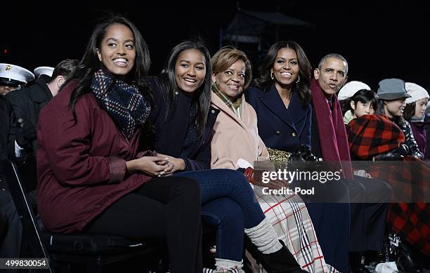 Malia Obama, Sasha Obama, mother-in-law Marian Robinson, first lady Michelle Obama and President Barack Obama attend the national Christmas tree...