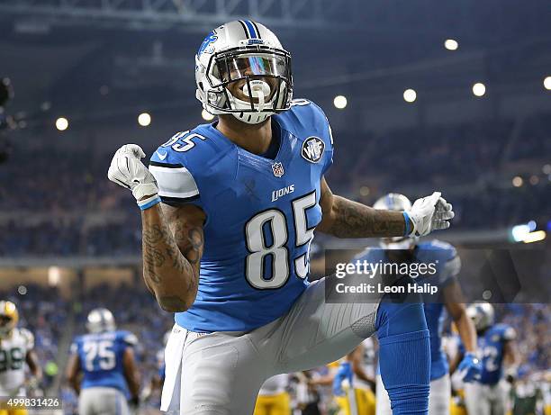 Eric Ebron of the Detroit Lions celebrates a first quarter touchdown against the Green Bay Packers on December 3 2015 at Ford Field in Detroit,...