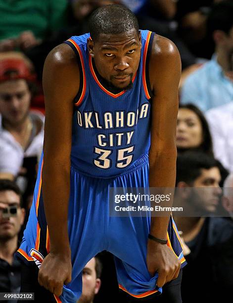 Kevin Durant of the Oklahoma City Thunder looks on during a game against the Miami Heat at American Airlines Arena on December 3, 2015 in Miami,...