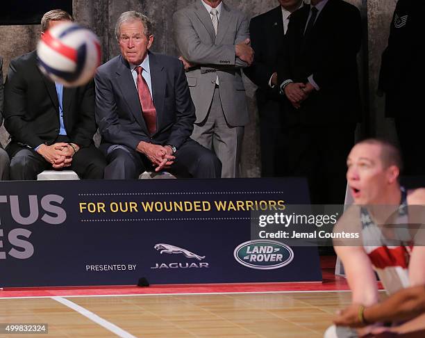 Former President George W. Bush watches a volleyball match between aspiring Invictus competitors during an event to announce a major initiative prior...