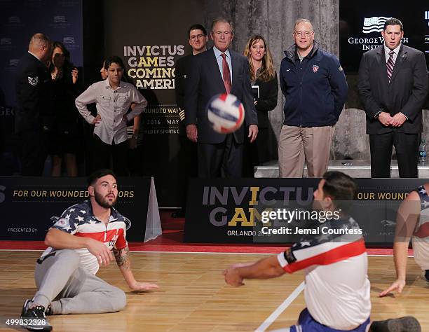 Former President George W. Bush watches a volleyball match between aspiring Invictus competitors during an event to announce a major initiative prior...