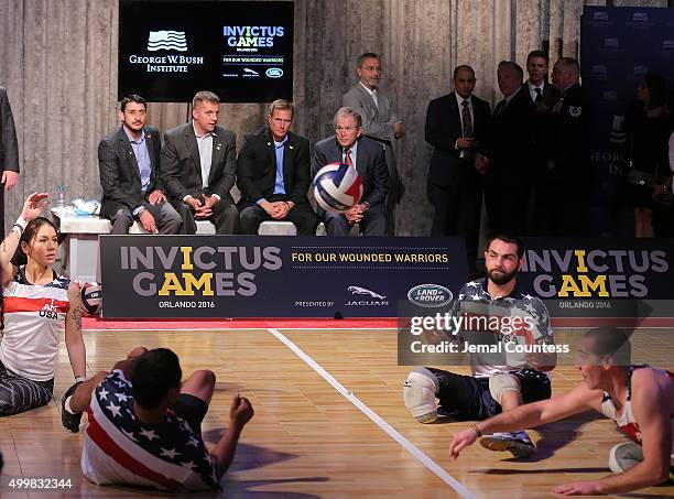 Former President George W. Bush watches a Vollyball match between aspiring Invictus competitors during an event to announce a major initiative prior...