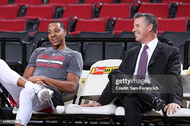 General Manager, Neil Olshey and C.J. McCollum of the Portland Trail Blazers speak before the game against the Indiana Pacers on December 3, 2015 at...