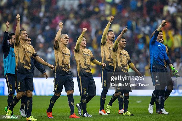 Players of Pumas celebrate after defeating America during the semifinals first leg match between America and Pumas UNAM as part of the Apertura 2015...