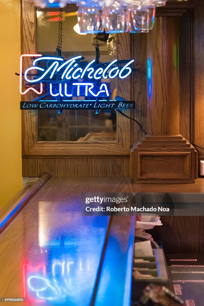 Michelob Ultra beer written in neon glow light inside a bar...