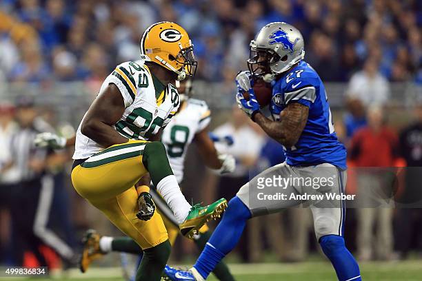 Free safety Glover Quin of the Detroit Lions carries the ball while being defended by wide receiver James Jones of the Green Bay Packers is the...