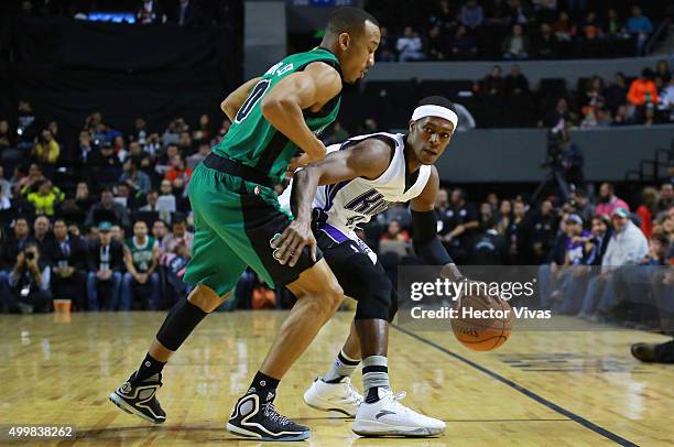 Rajon Rondo of Sacramento Kings drives the ball against Avery Bradley of Boston Celtics during the match between Sacramento Kings and Boston Celtics...