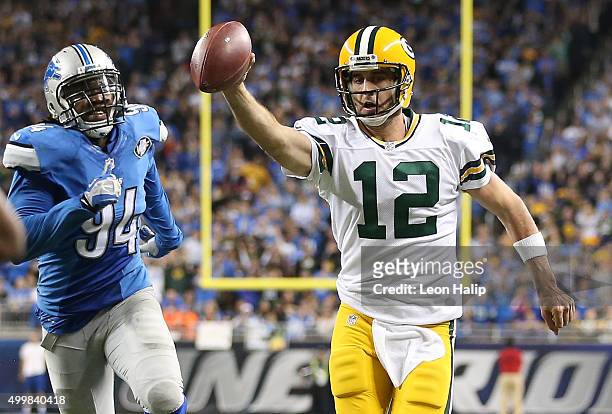 Aaron Rodgers of the Green Bay Packers runs the ball for a fourth quarter touchdown against the Detroit Lions on December 3 2015 at Ford Field in...