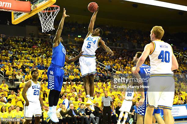 Prince Ali of the UCLA Bruins dunks over Alex Poythress of the Kentucky Wildcats during an 87-77 UCLA win at Pauley Pavilion on December 3, 2015 in...
