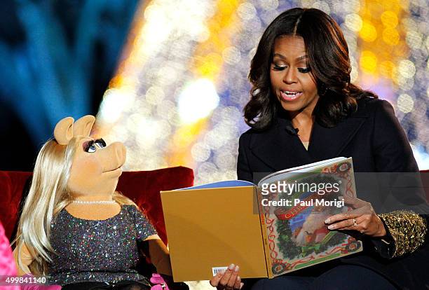First Lady Michelle Obama and Muppet Miss Piggy read 'Twas the Night Before Christmas' to children at the 93rd Annual National Christmas Tree...