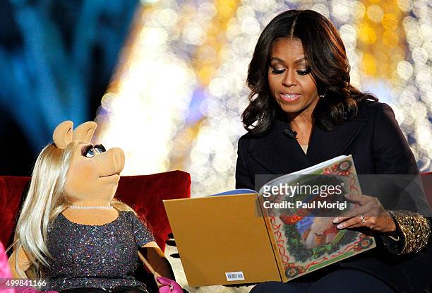 First Lady Michelle Obama and Muppet Miss Piggy read 'Twas the Night Before Christmas' to children at the 93rd Annual National Christmas Tree...