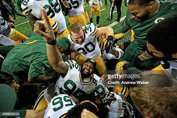 Nose tackle Letroy Guion of the Green Bay Packers celebrates after tight end Richard Rodgers caught the game-winning touchdown with time expired to...