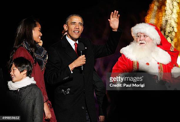 President Barack Obama waves to the audience during the 93rd Annual National Christmas Tree Lighting at The Ellipse on December 3, 2015 in...