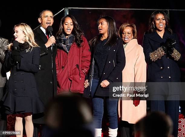 Reese Witherspoon and U.S. President Barack Obama and the First family onstage during the 93rd Annual National Christmas Tree Lighting at The Ellipse...