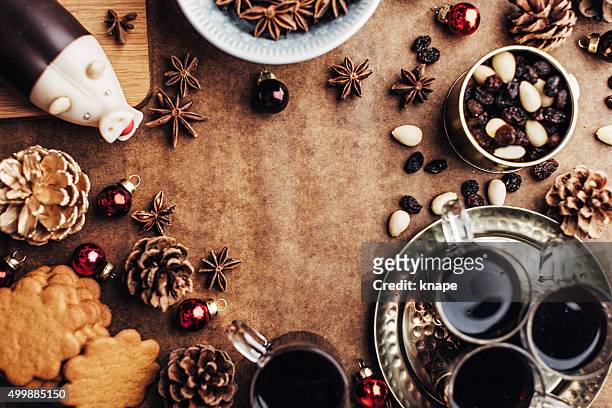 christmas background with glögg ginger bread cookies and other food - glögg stockfoto's en -beelden