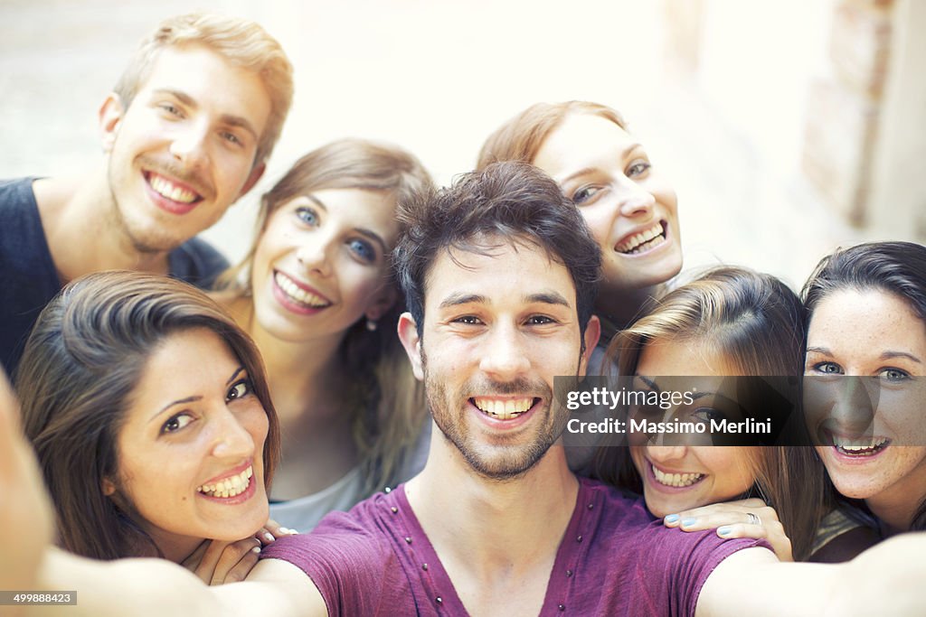 Group of students taking selfie outdoors