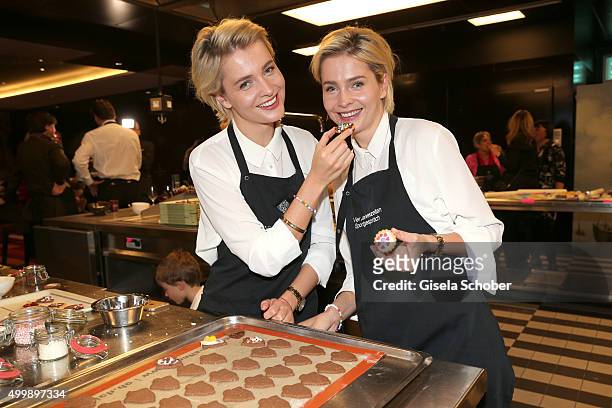 Julia Meise and her twin sister Nina Meise during the World Childhood Foundation Baking at Hotel Vier Jahreszeiten on November 30, 2015 in Munich,...