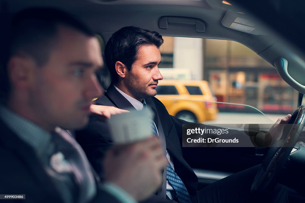 Two businessmen in car