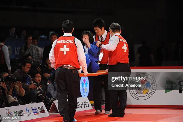 Turkish judoka Ebru Sahin gestures after getting injured during his fight against Russian judoka Natalia Kondratyeva in the women's 48-kilogram...