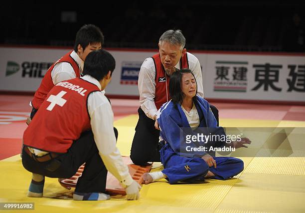 Turkish judoka Ebru Sahin gestures after getting injured during his fight against Russian judoka Natalia Kondratyeva in the women's 48-kilogram...