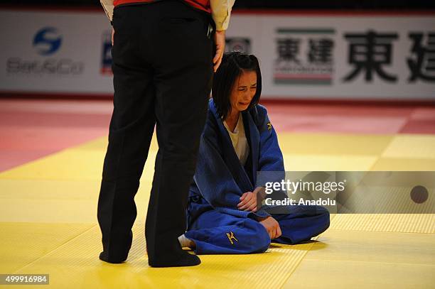 Turkish judoka Ebru Sahin gestures after getting injured during his fight against Russian judoka Natalia Kondratyeva in the women's 48-kilogram...