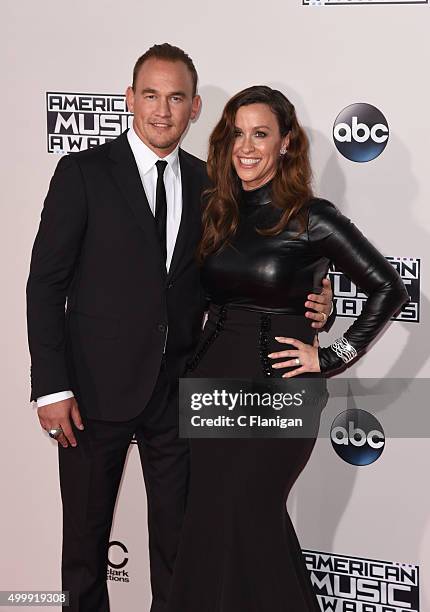 Singer Alanis Morissette and husband Mario Treadway arrive at the 2015 American Music Awards at Microsoft Theater on November 22, 2015 in Los...