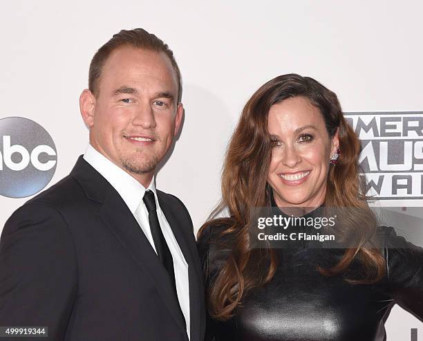 Singer Alanis Morissette and husband Mario Treadway arrive at the 2015 American Music Awards at Microsoft Theater on November 22, 2015 in Los...