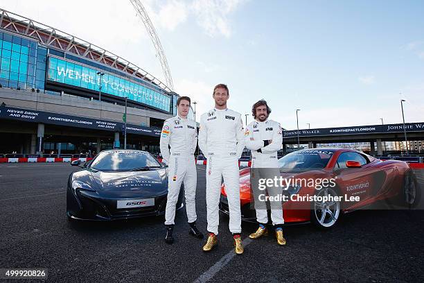 McLaren Hondas Jenson Button and Fernando Alonso and McLaren Honda Test Driver Stoffel Vandoorne pose for photographs outside Wembley Stadium on...