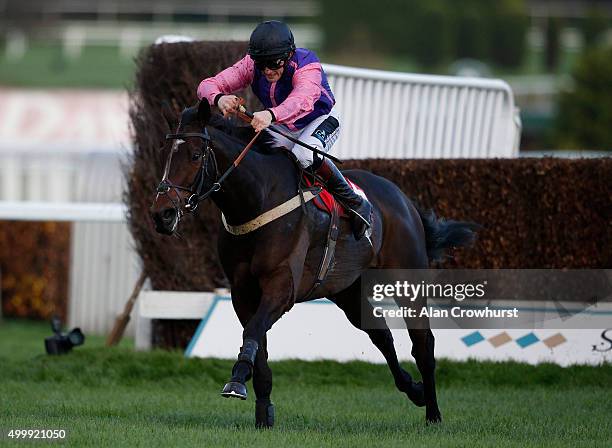 Jamie Moore riding Antony clear the last to win The Amlin Insurance Novices' Limited Handicap Steeple Chase at Sandown racecourse on December 04,...