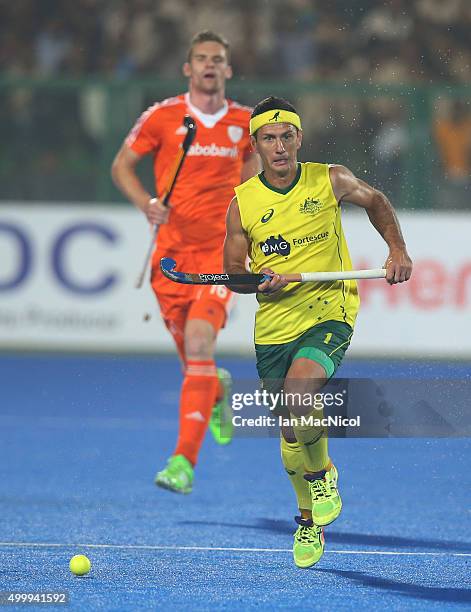 Jamie Dwyer of Australia runs with the ball during the match between Australia and Netherlands on day eight of The Hero Hockey League World Final at...