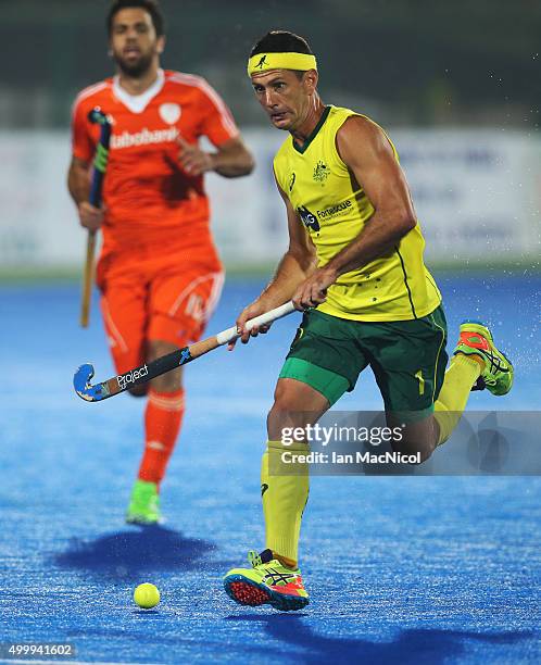 Jamie Dwyer of Australia runs with the ball during the match between Australia and Netherlands on day eight of The Hero Hockey League World Final at...