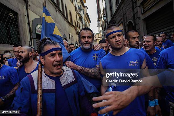 Calcianti of the La Santa Croce Azzurri Team march their way through the streets to La Santa Croce square before the semi-final match against the San...