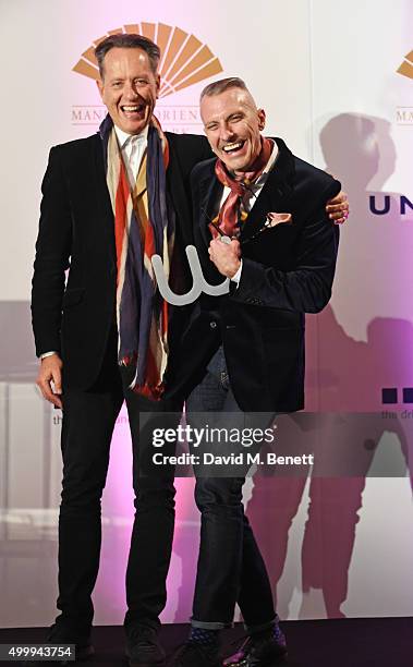 Richard E. Grant and Ed Burstell, winner of the Winq Business Award, attend the Winq Magazine Men of the Year lunch to benefit the Elton John Aids...