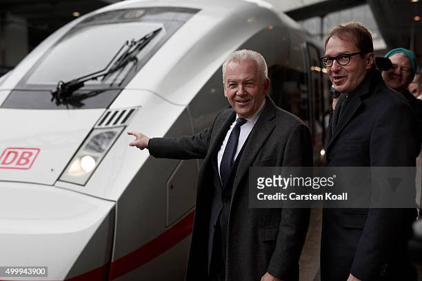 Rudiger Grube , CEO of Deutsche Bahn, and Alexander Dobrindt , Federal Minister of Transport and digital infrastructure, pose in front of the ICE 4...