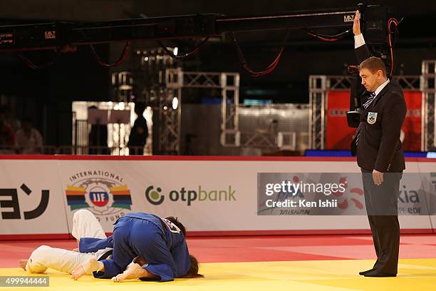 Yuki Hashimoto of Japan holds Mareen Kraeh of Germany for ippon in the Women's 52kg bronze medal match between Yuki Hashimoto of Japan and Mareen...