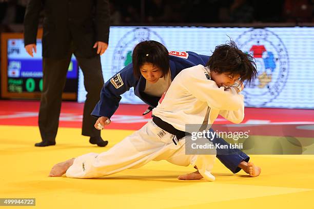 Ai Shishime of Japan attempts to throw Misato Nakamura of Japan in the Women's 52kg final match at Tokyo Metropolitan Gymnasium on December 4, 2015...