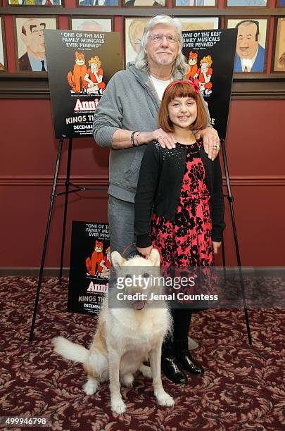 Director and lyricist Martin Charmin, actress Issie Swickle and Mikey pose for a photo at the "Annie" Cast Phototcall at Sardi's on December 4, 2015...