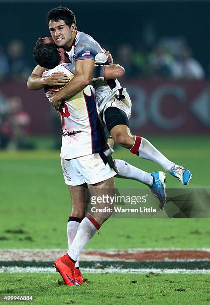 Madison Hughes of the USA celebrates with team mate Zack Test after kicking the winning points to beat New Zealand during the Emirates Dubai Rugby...