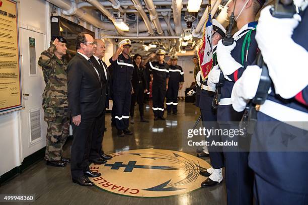 This photo released on Friday, Dec. 4, 2015 by the French Army Communications Audiovisual office shows France's President, Francois Hollande...