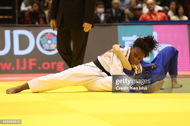 Priscilla Gneto of France holds Evelyne Tschopp of Swiss for ippon in the Women's 52kg preliminary at Tokyo Metropolitan Gymnasium on December 4,...