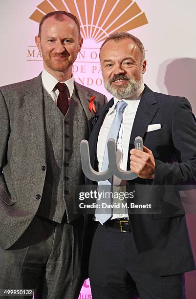 Mark Gatiss and Graham Norton, winner of the Winq Man Of The Year award, pose onstage at the Winq Magazine Men of the Year lunch to benefit the Elton...