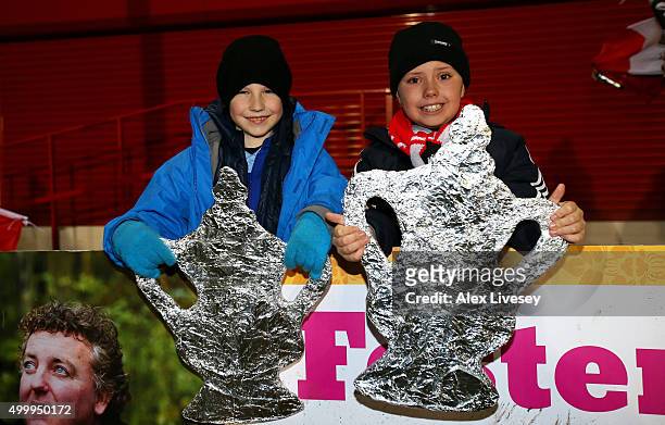 Salford City fans display their tin foil FA Cups prior to the Emirates FA Cup Second Round match between Salford City and Hartlepool United at Moor...