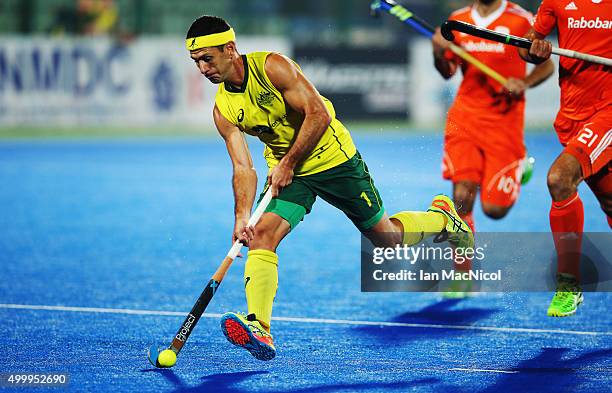 Jamie Dwyer of Australia runs with the ball during the match between Australia and Netherlands on day eight of The Hero Hockey League World Final at...