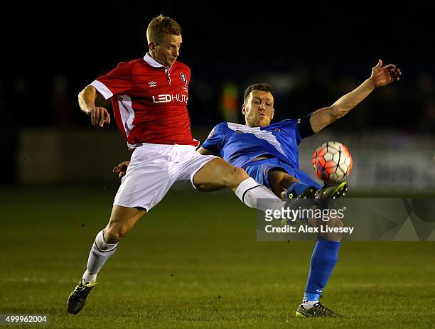 Gray Stopforth of Salford City battles for the ball with Carl Magnay of Hartlepool United during the Emirates FA Cup Second Round match between...