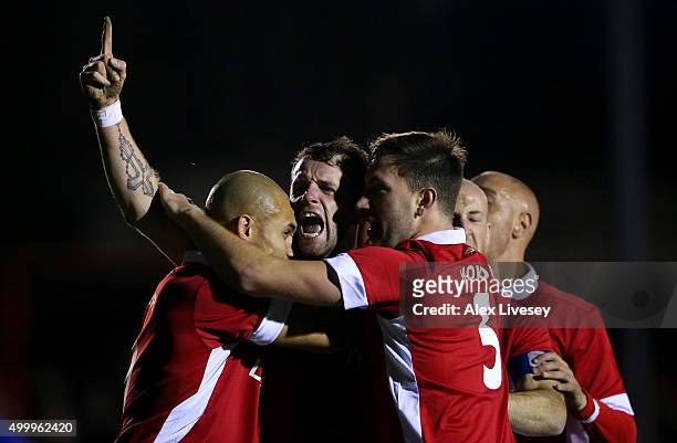 Stephen O'Halloran of Salford City celebrates with his team mates after scoring his side's first goal during the Emirates FA Cup Second Round match...