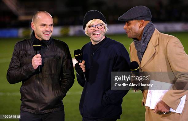Former footballer Danny Murphy, Tim Burgess, lead singer of The Charlatans and former footballer Trevor Sinclair talk at half time on the BBC during...