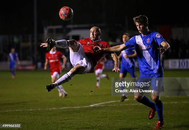 Chris Lynch of Salford City does an overhead kick past Rhys Oates of Hartlepool United during the Emirates FA Cup Second Round match between Salford...